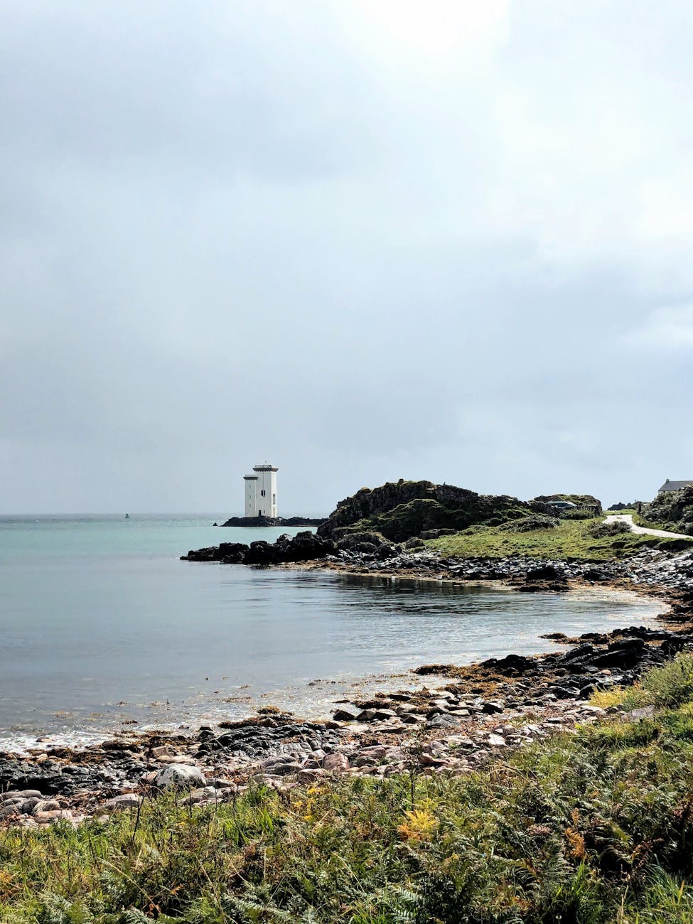 Tranquil Scottish island coastline with historic ruins