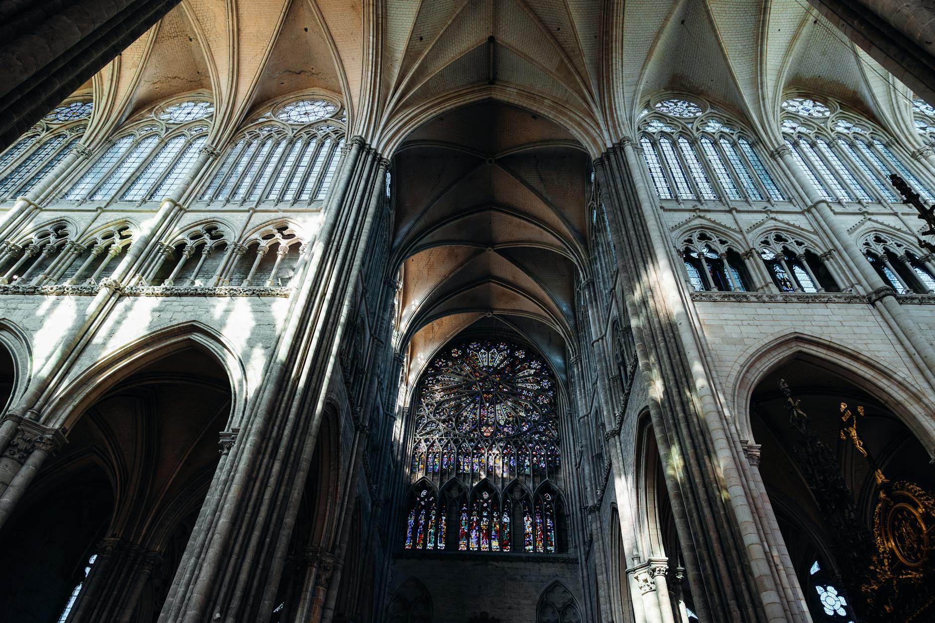 Stained glass and gothic arches inside Glasgow Cathedral