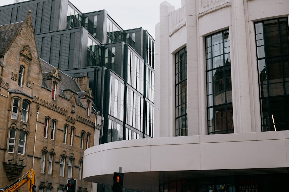 A blend of modern and Victorian architecture in Glasgow city centre with historic buildings and modern glass facades