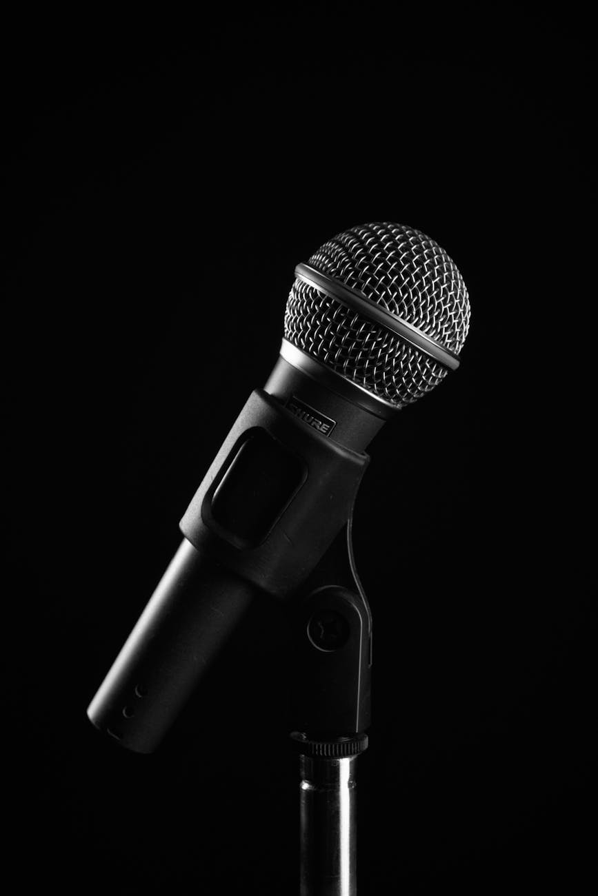 Stand-up comedy performance with spotlight on stage