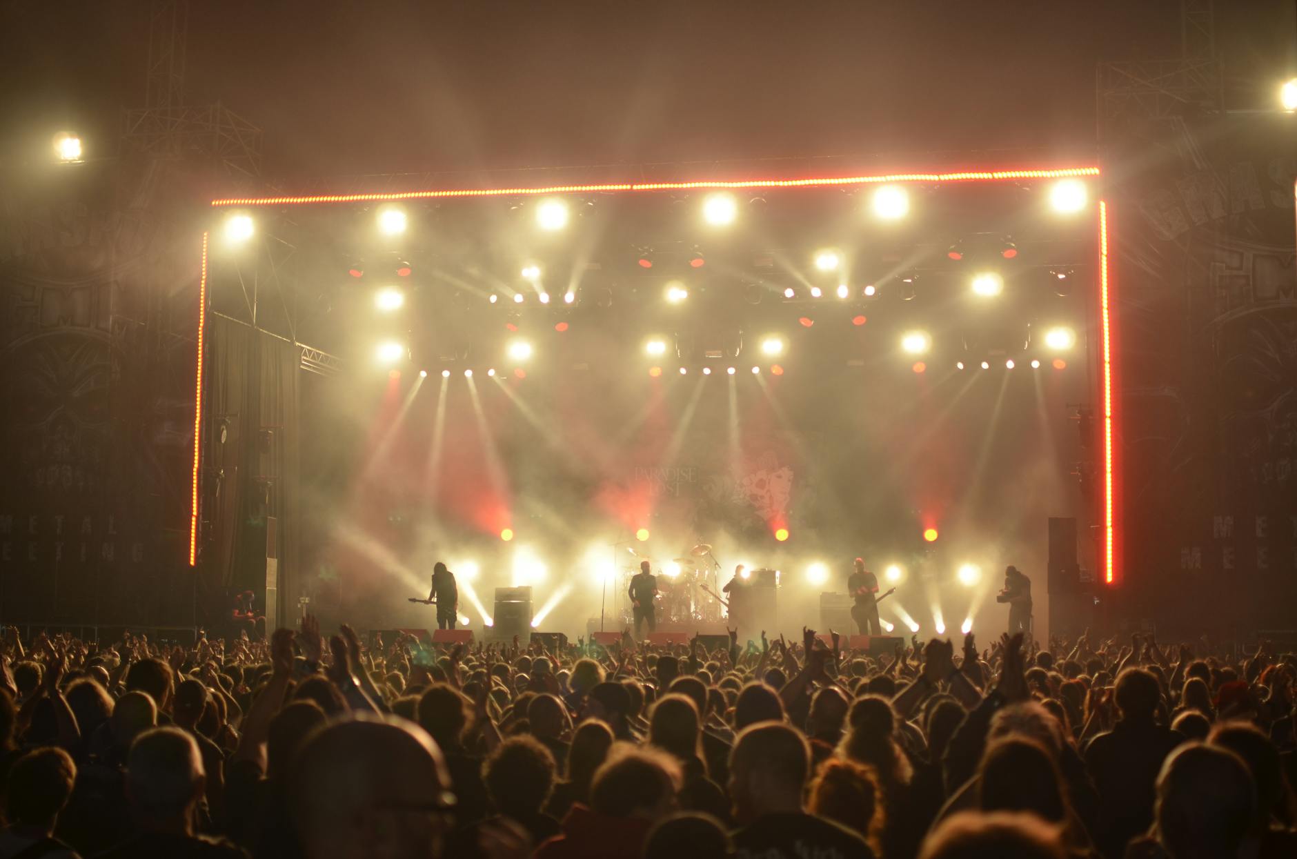 Concert stage with dramatic lighting during live performance