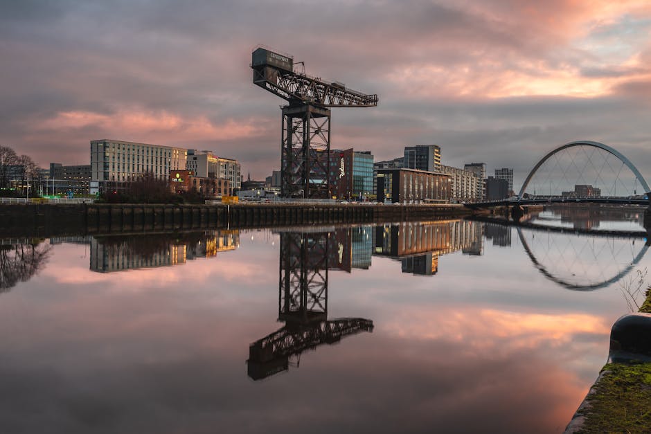 Sunset view of Glasgow River Clyde waterfront near Finnieston with the OVO Hydro arena in the background