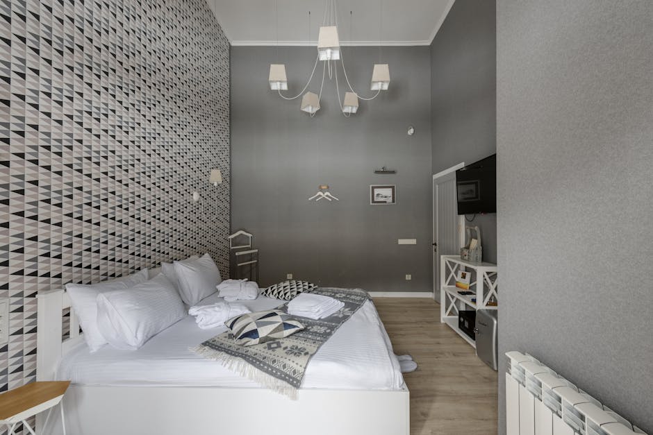 Where to stay in Glasgow - Stylish boutique hotel bedroom with modern decor and comfortable furnishings in Glasgow