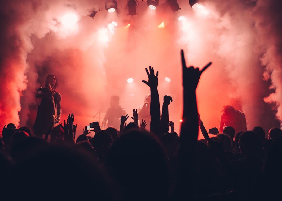 Live band performing on stage at an intimate Glasgow music venue with coloured lights