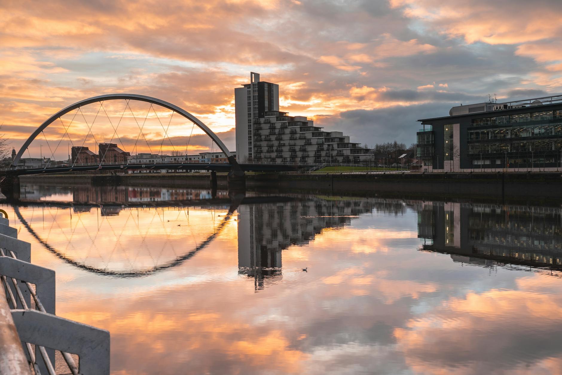 Glasgow Clyde Arc bridge reflected in the River Clyde at dusk