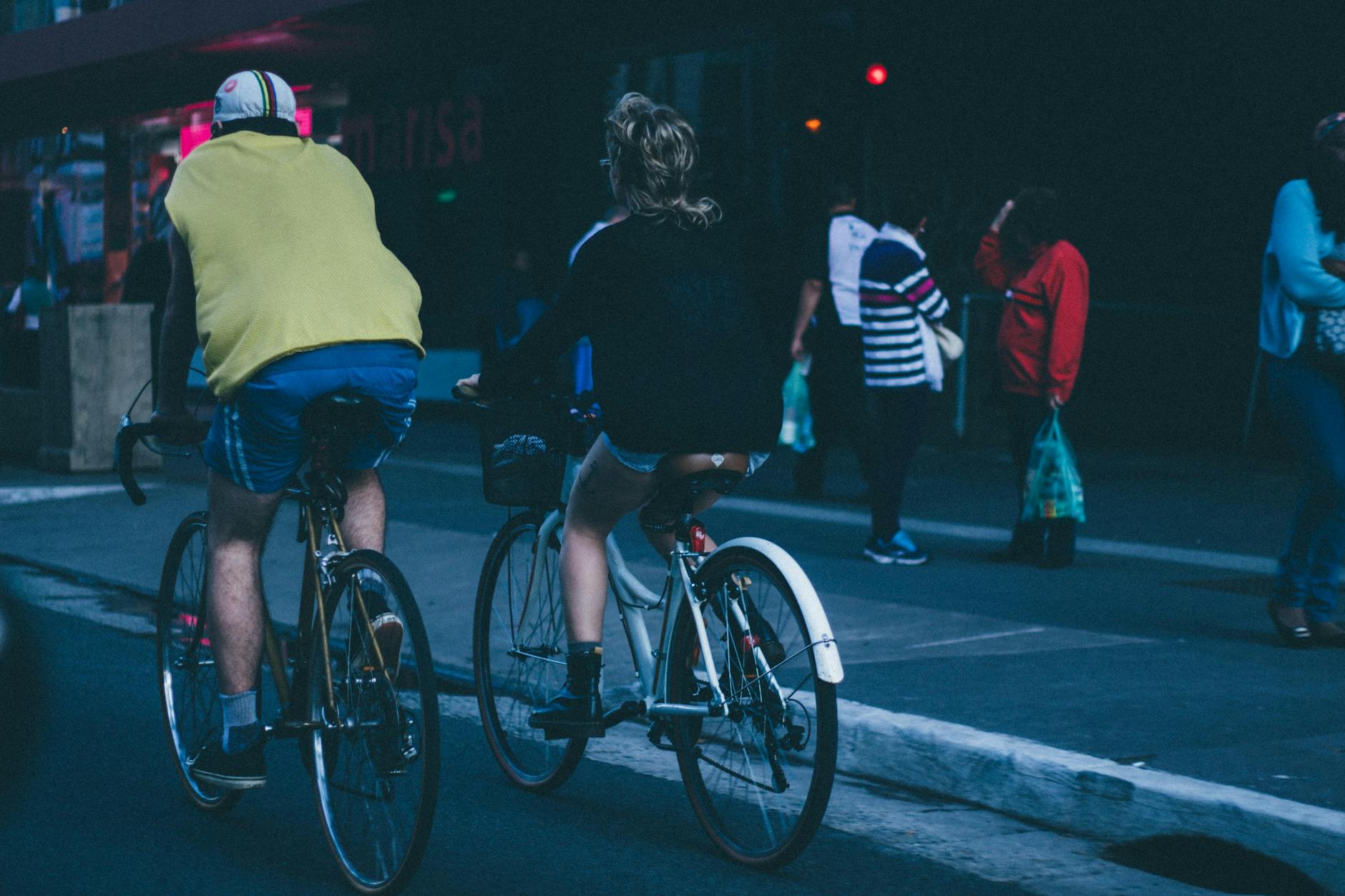 Cyclist riding through city streets on dedicated bike lane