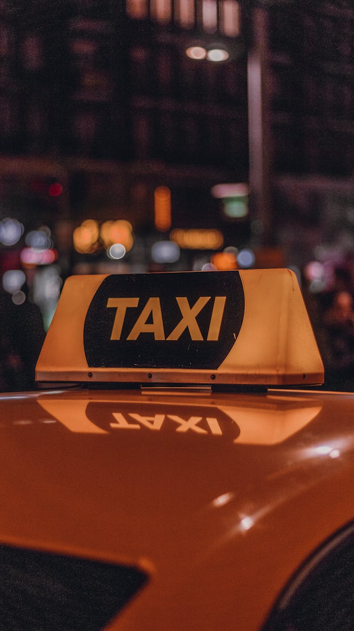 Taxi cab available for hire in city centre at night