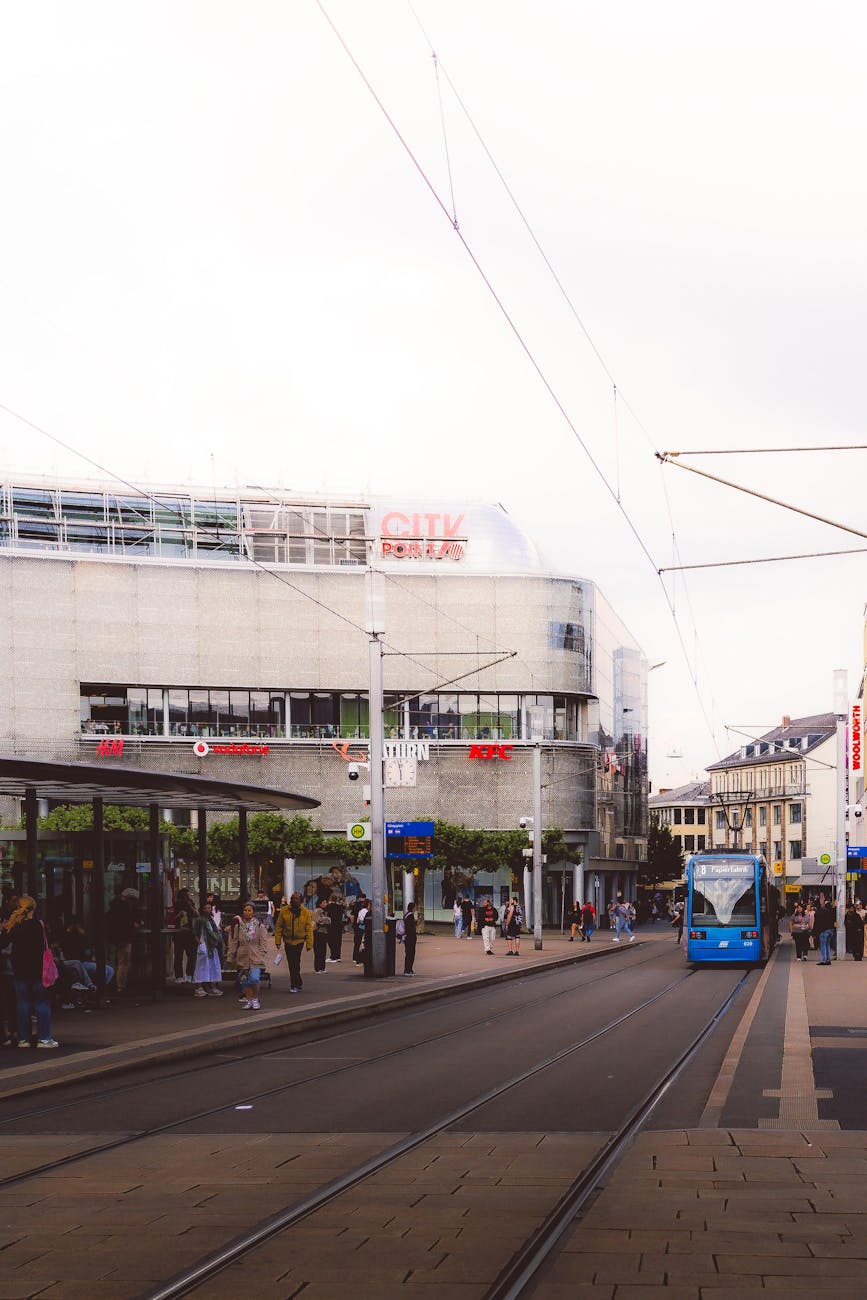 Pedestrians walking through vibrant city centre street