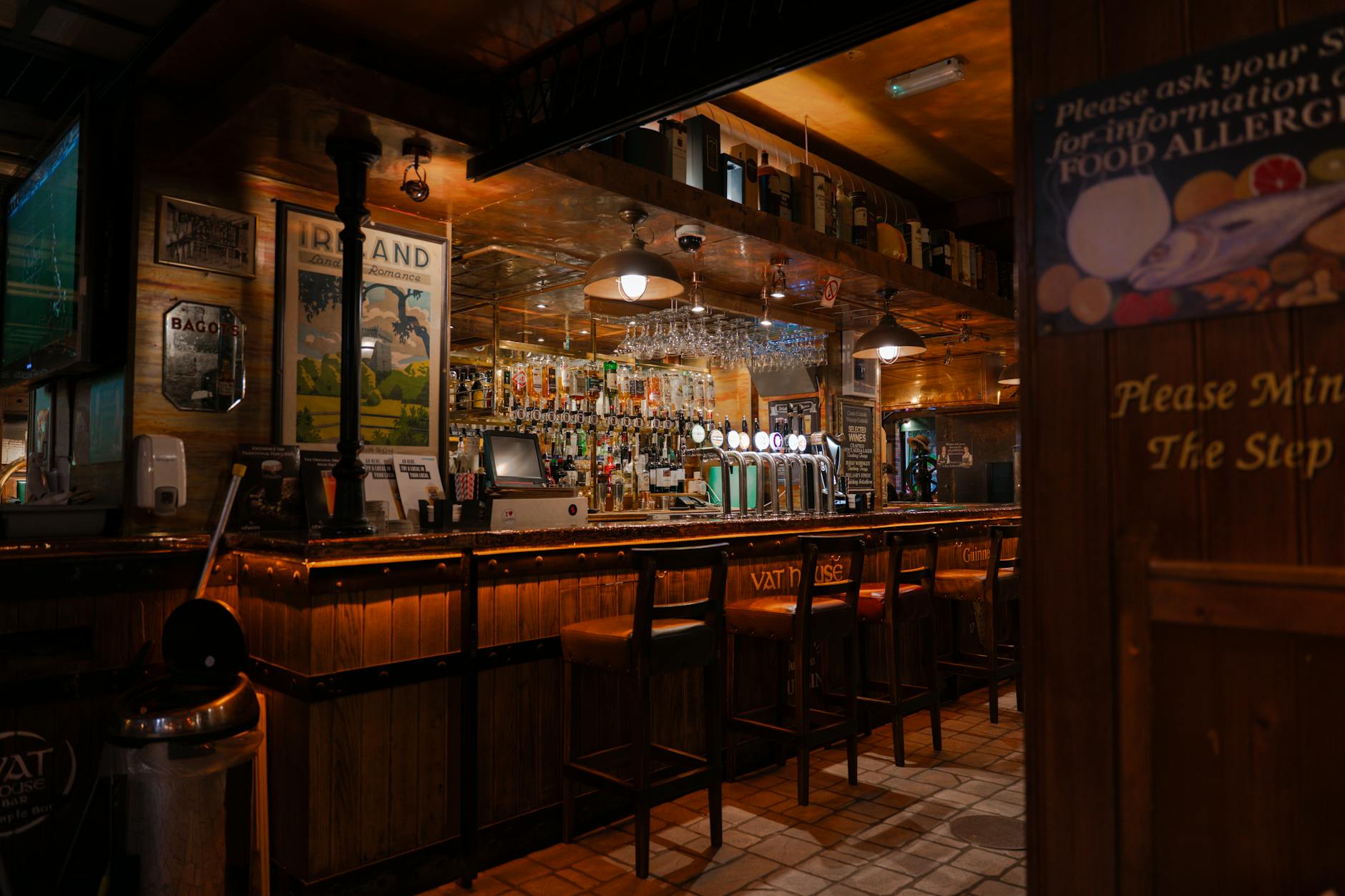 Traditional pub interior with dark wood bar in Glasgow