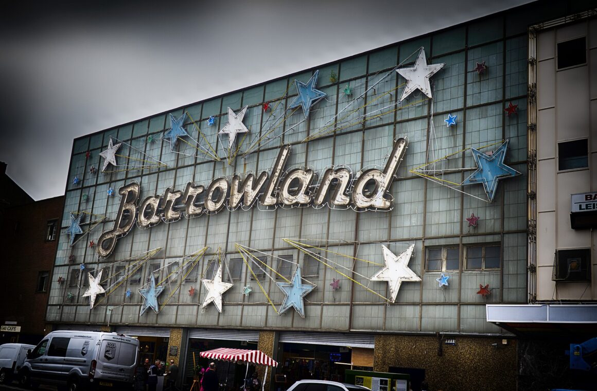 The Barrowland Ballroom neon sign and stars on the Gallowgate frontage under a grey Glasgow sky