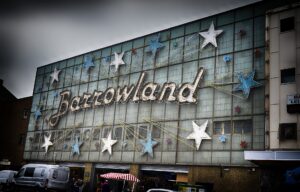 The Barrowland Ballroom neon sign and stars on the Gallowgate frontage under a grey Glasgow sky