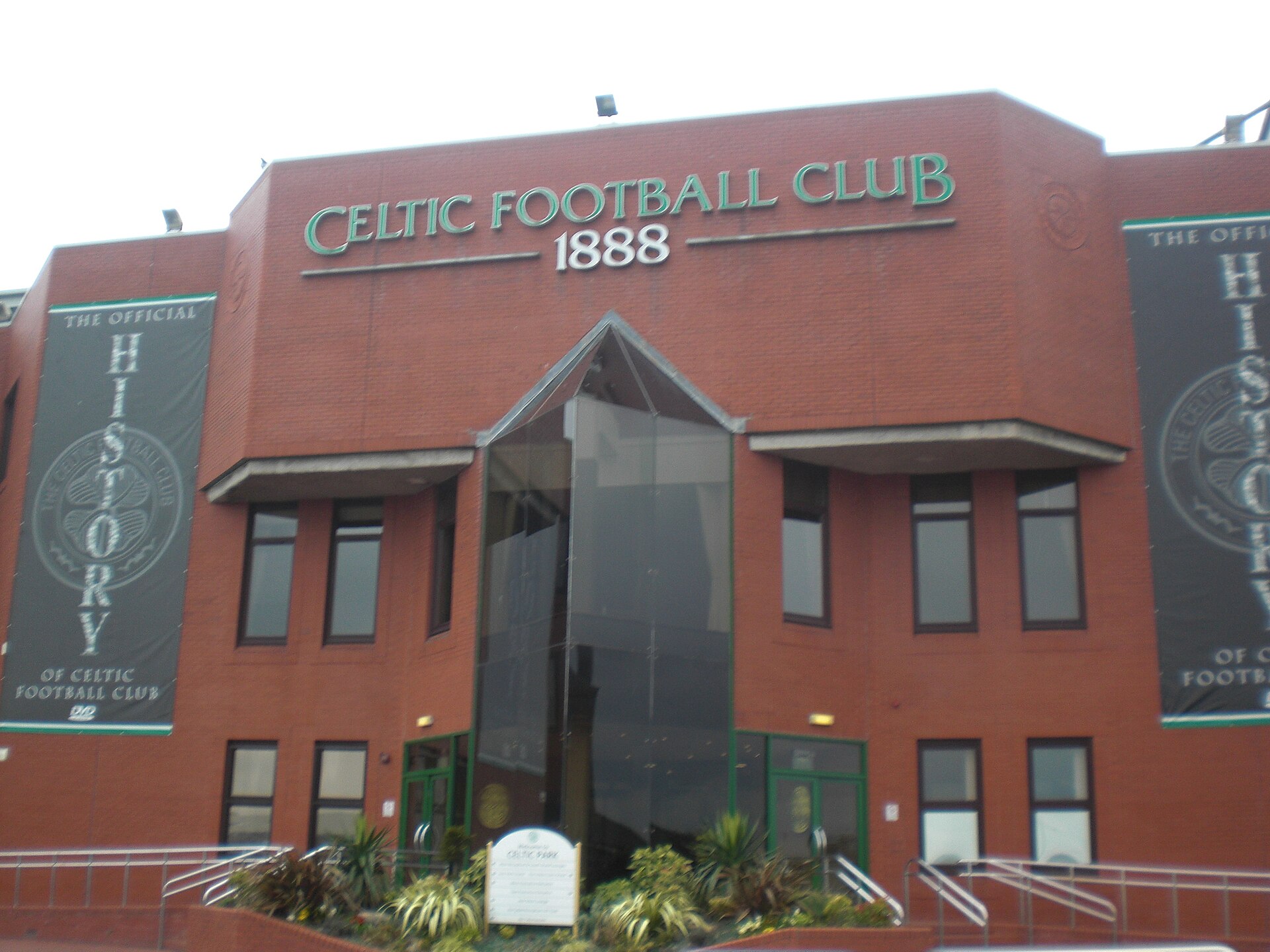 The red-brick main reception building at Celtic Park with CELTIC FOOTBALL CLUB 1888 lettering above the entrance