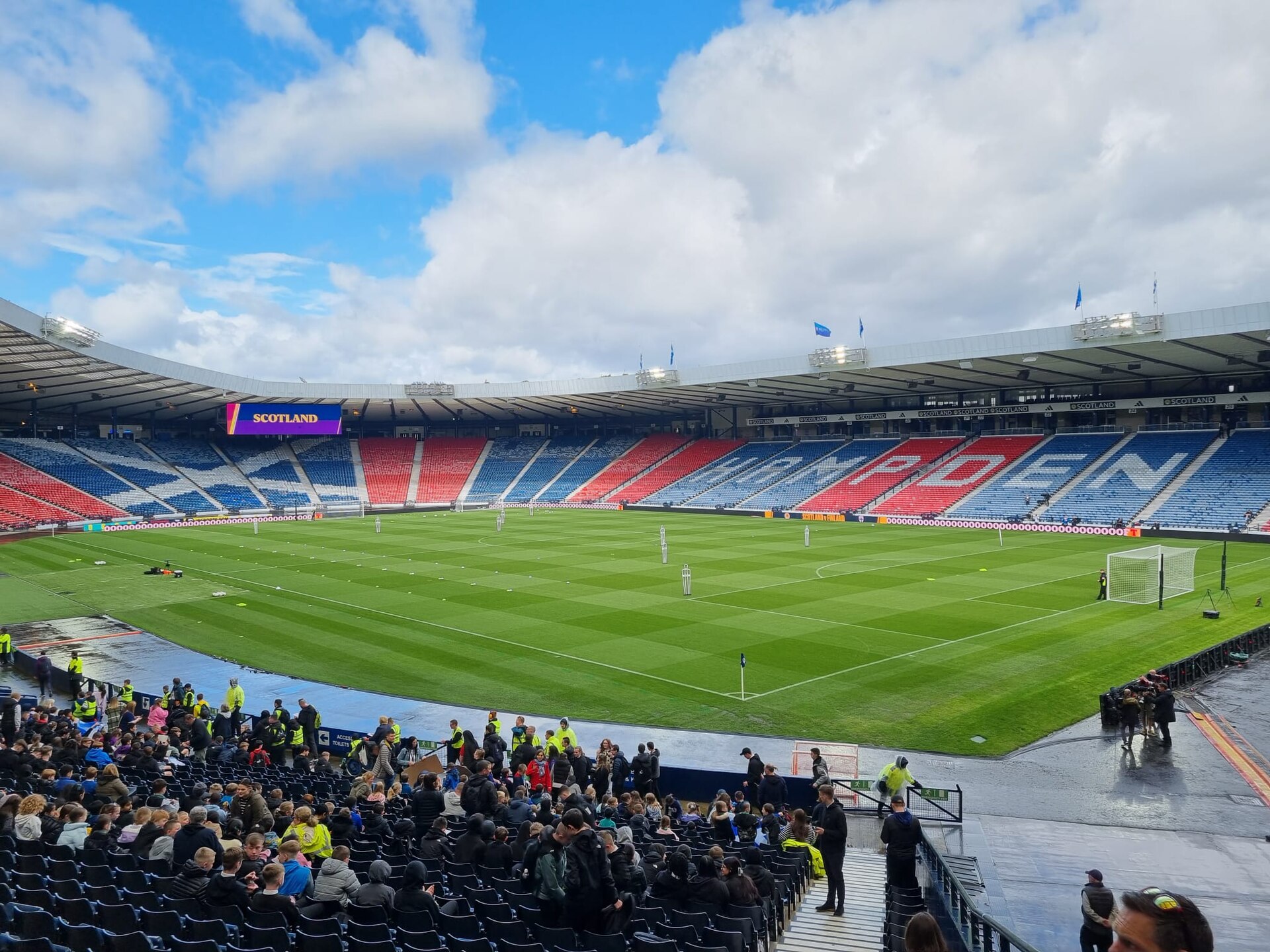 The interior of Hampden Park with the saltire picked out in red, white and blue seating and HAMPDEN spelt across the far stand