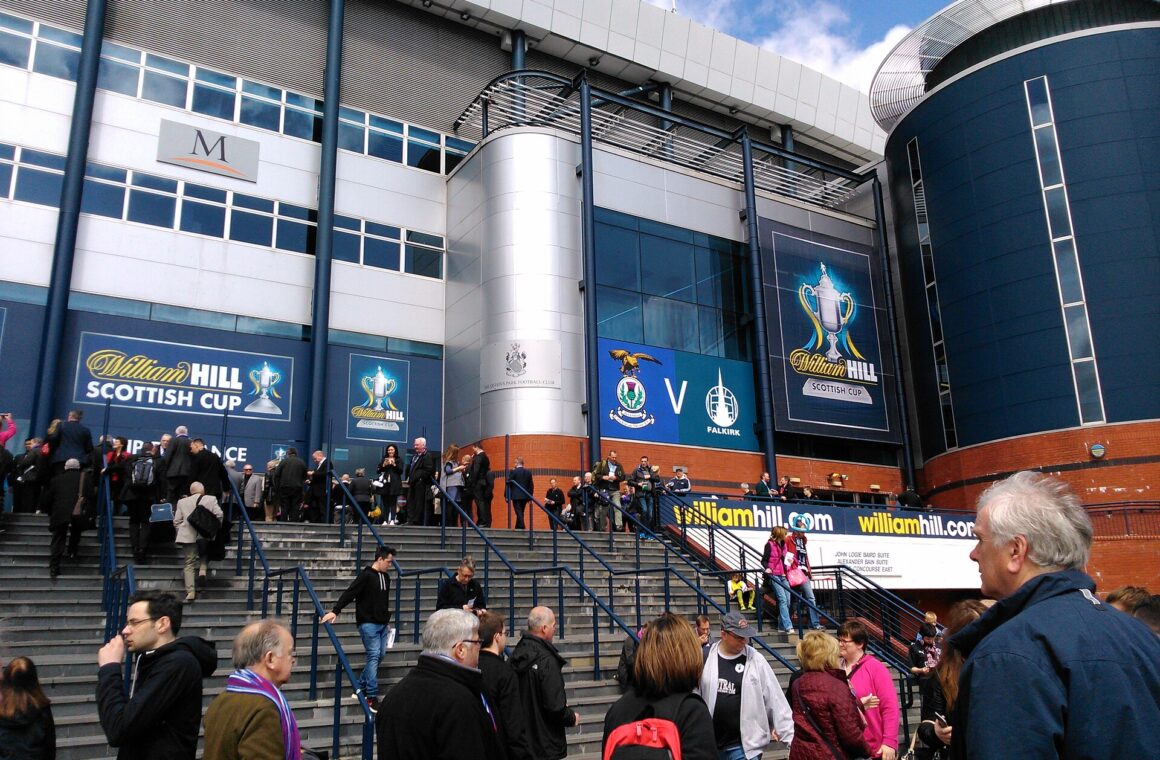 Crowds climbing the wide external steps to the south stand entrance at Hampden Park on a Scottish Cup final day