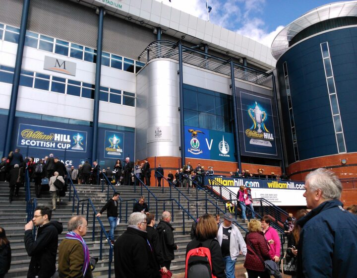 Crowds climbing the wide external steps to the south stand entrance at Hampden Park on a Scottish Cup final day