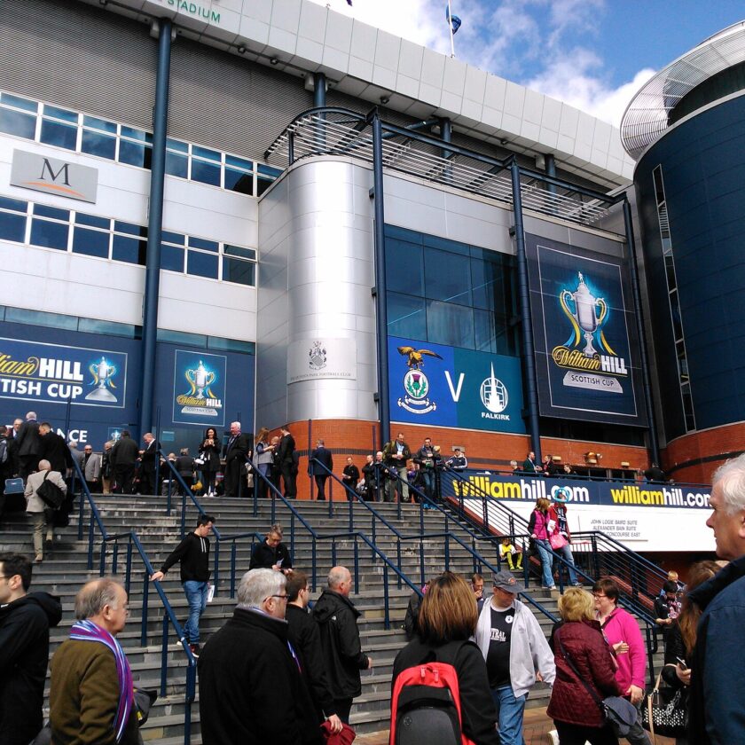 Crowds climbing the wide external steps to the south stand entrance at Hampden Park on a Scottish Cup final day