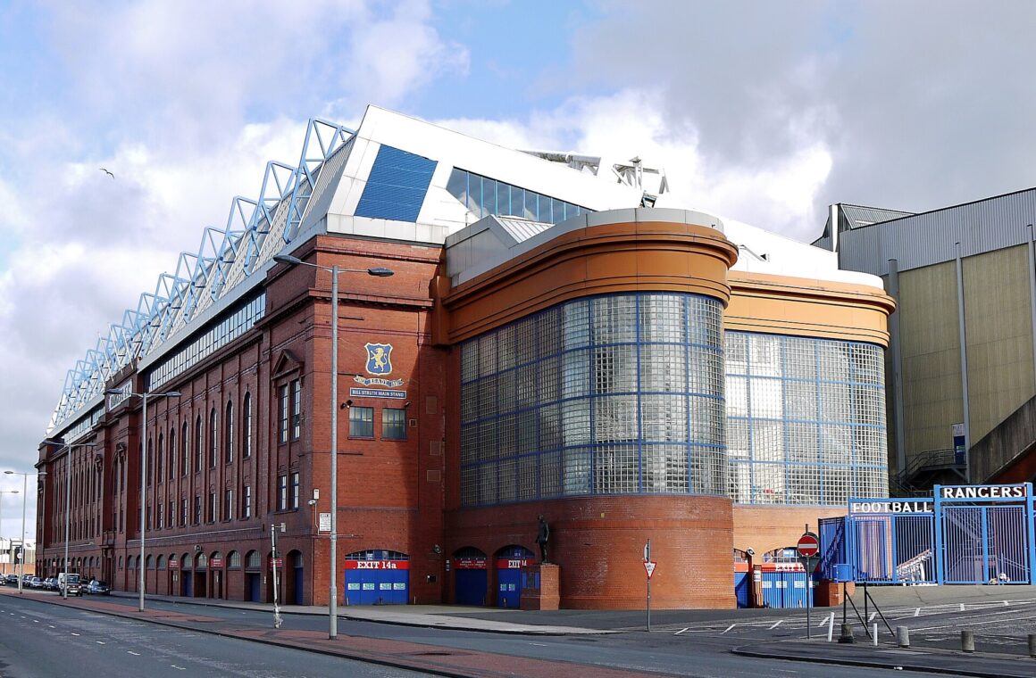 The red-brick Bill Struth Main Stand at Ibrox on Edmiston Drive, with its curved glass-block corner and club crest